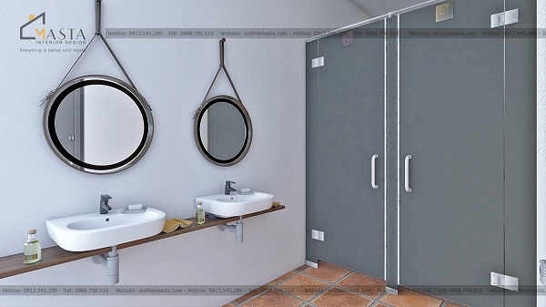 Khu vực WC bố trí gương tròn để khách hàng dễ dàng chỉnh trang lại tóc tai